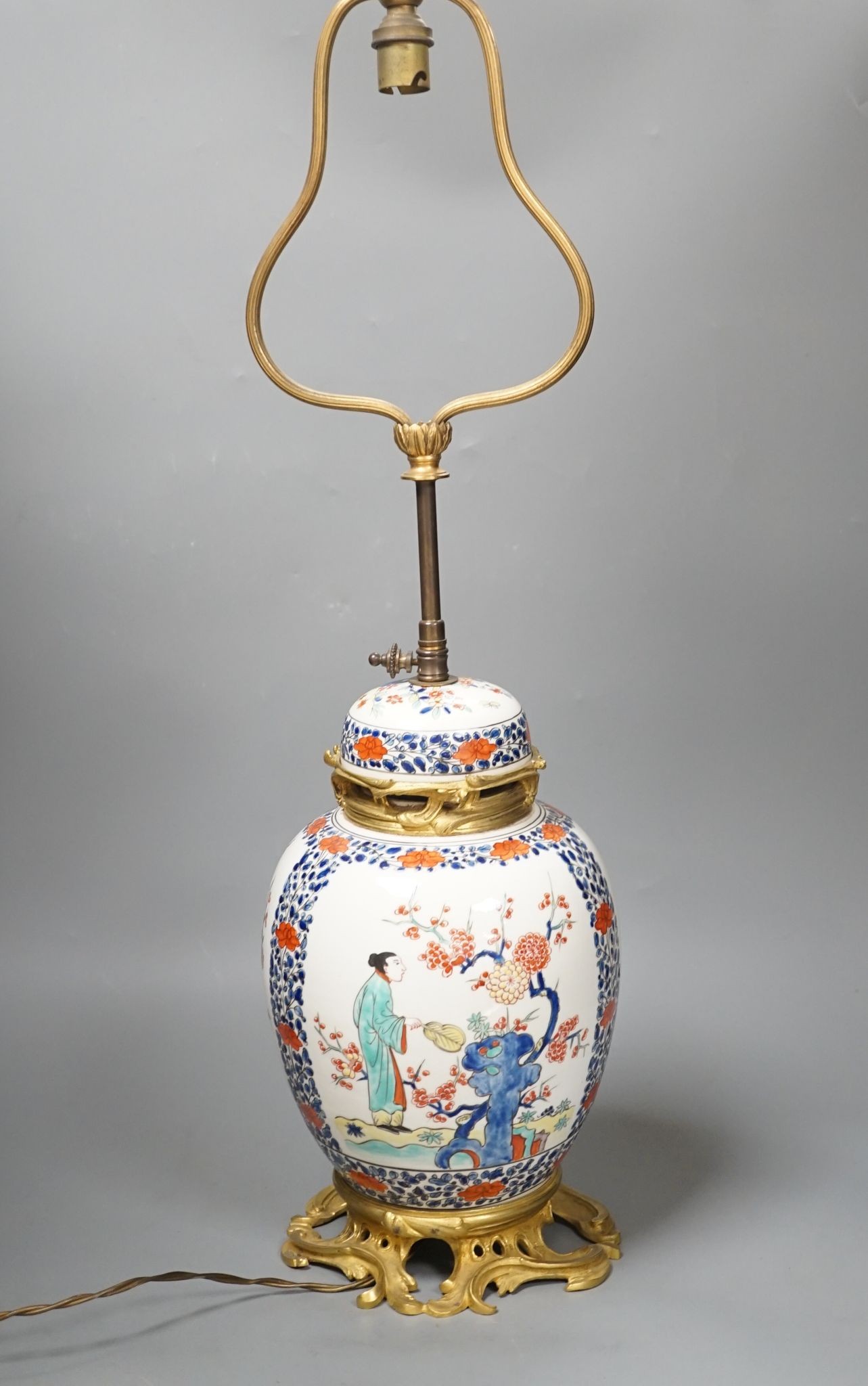 A European porcelain table lamp in the Oriental style, 63 cms high.